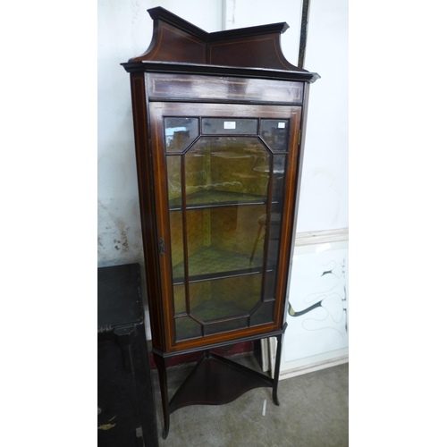 100 - An Edward VII inlaid mahogany corner cabinet on stand