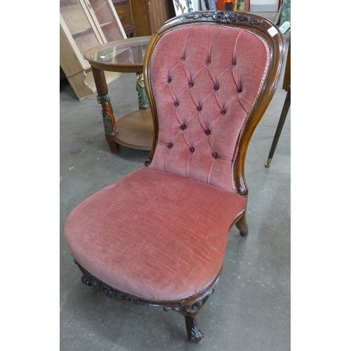 106 - A Victorian mahogany spoonback nursing chair