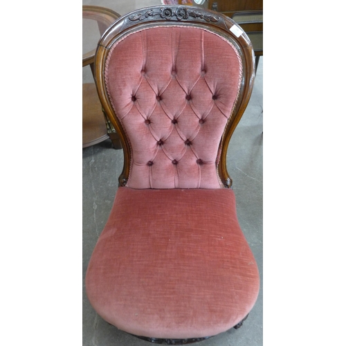 106 - A Victorian mahogany spoonback nursing chair