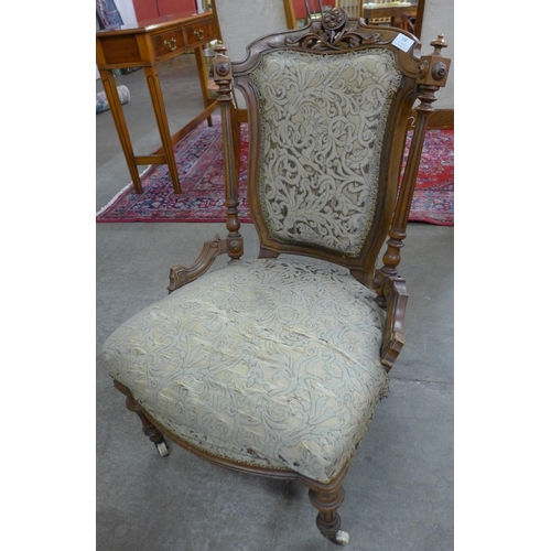 108 - A Victorian walnut and fabric upholstered ladys chair