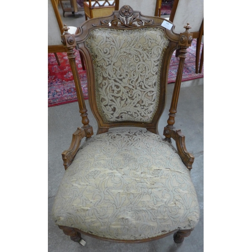 108 - A Victorian walnut and fabric upholstered ladys chair