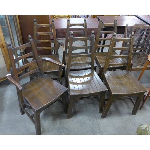 112 - A set of six Arts and Crafts oak ladderback dining chairs