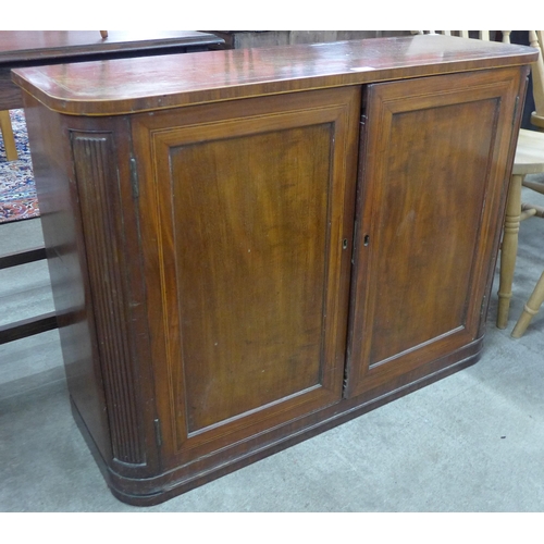 117 - A George IV inlaid mahogany two door cupboard