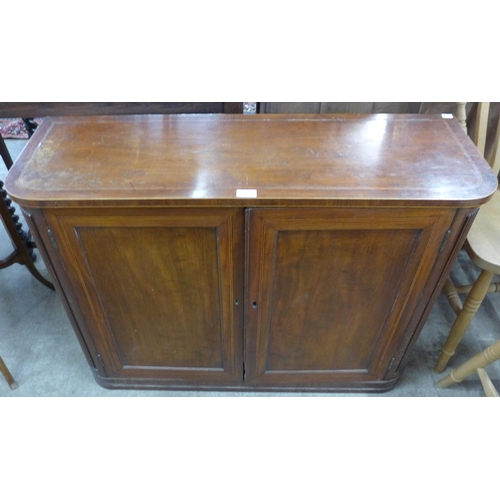 117 - A George IV inlaid mahogany two door cupboard