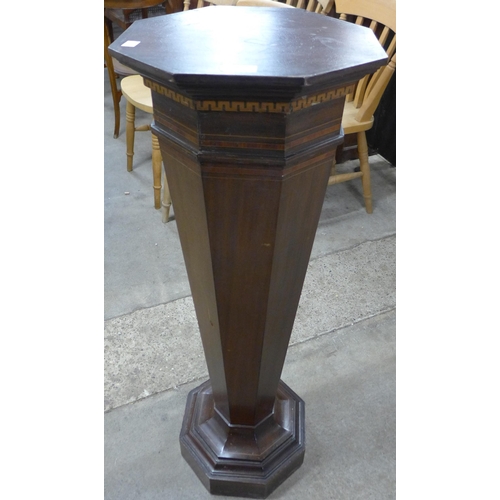 118A - An Edward VII inlaid mahogany octagonal torchere