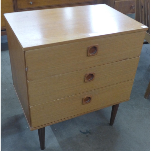 12 - A teak chest of drawers