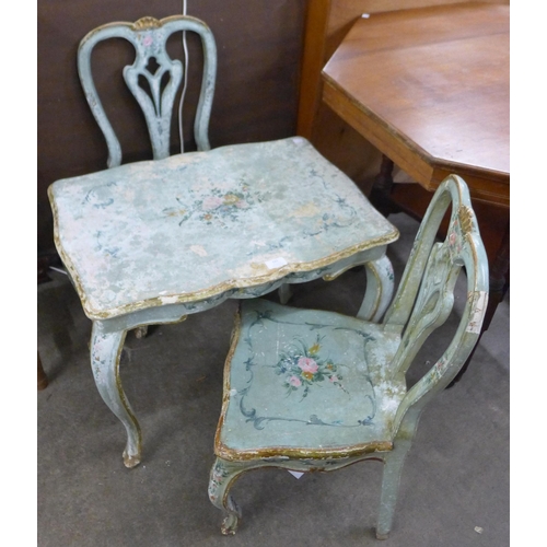 121 - An Italian style painted occasional table and two chairs