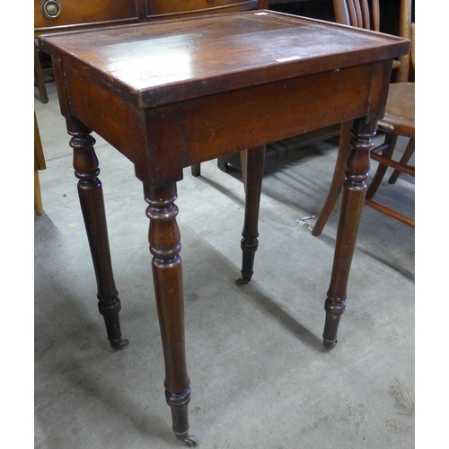 126 - A Victorian mahogany occasional table with brush and slides