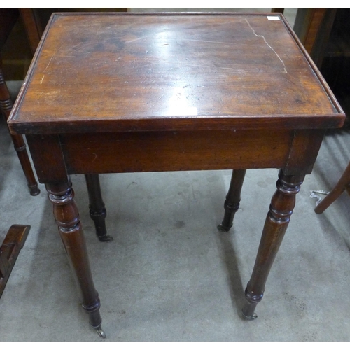 126 - A Victorian mahogany occasional table with brush and slides