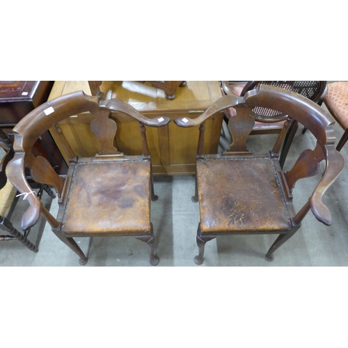 137 - A pair of George III style mahogany corner chairs