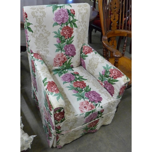 145 - An early 20th Century mahogany and fabric upholstered armchair