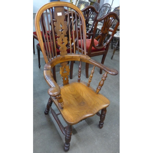 146 - A 19th Century elm and yew wood highback Windsor chair