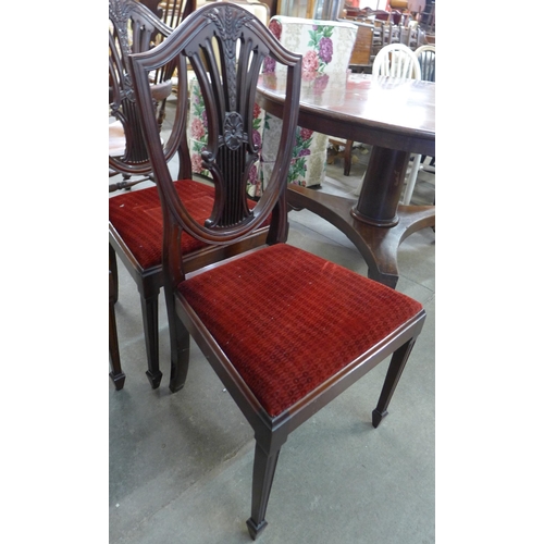 147 - A set of four Hepplewhite style mahogany dining chairs