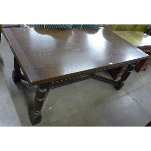 150 - An oak draw-leaf refectory table