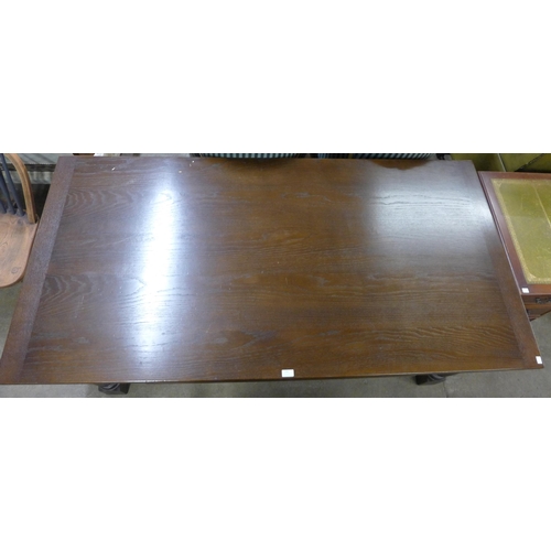 150 - An oak draw-leaf refectory table