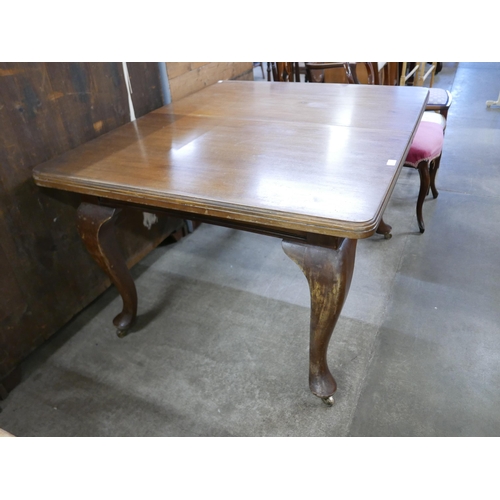 157 - A Victorian mahogany dining table