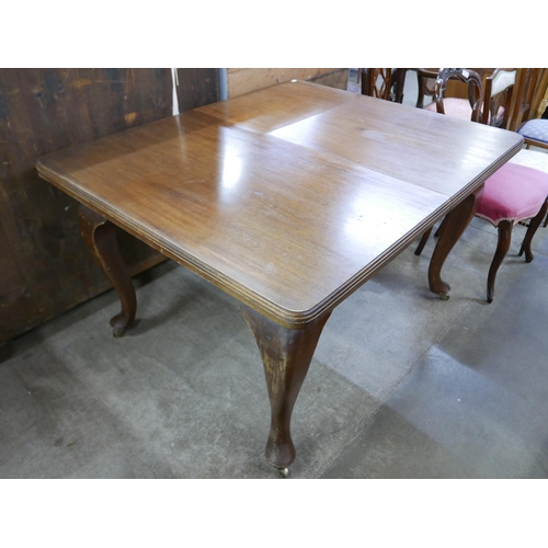 157 - A Victorian mahogany dining table