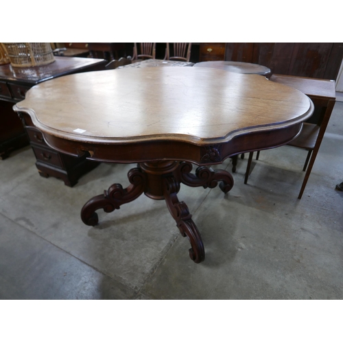 163 - A 19th Century French walnut serpentine centre table