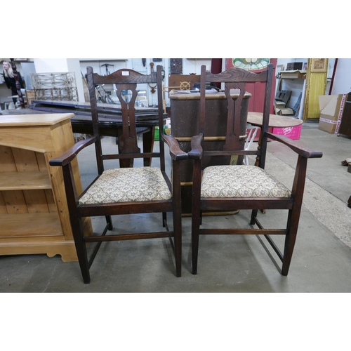 175 - A pair of Arts and Crafts oak armchairs