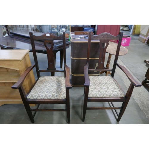 175 - A pair of Arts and Crafts oak armchairs