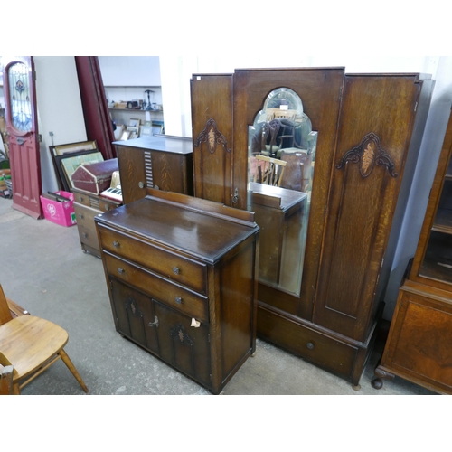 179 - An Art Deco oak five piece bedroom suite, comprising; wardrobe, chest of drawers, two tallboys and a... 