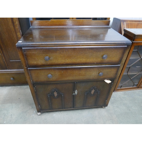 179 - An Art Deco oak five piece bedroom suite, comprising; wardrobe, chest of drawers, two tallboys and a... 