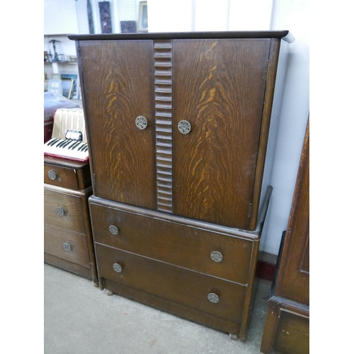 179 - An Art Deco oak five piece bedroom suite, comprising; wardrobe, chest of drawers, two tallboys and a... 