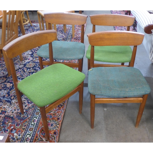 18 - A set of four teak dining chairs