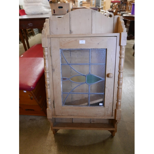 186 - A pine and stained glass wall hanging cupboard