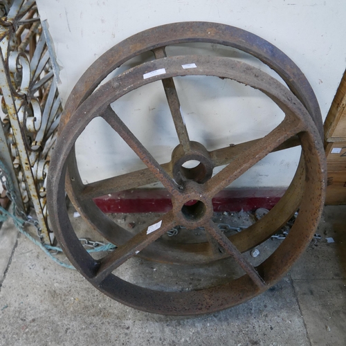 189 - A pair of industrial cast iron wheels