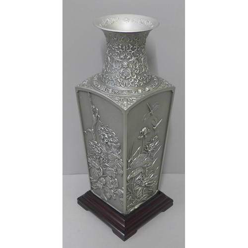 234 - A box of Royal Selangor pewter Four Seasons Collection four-sided vase with wooden stand