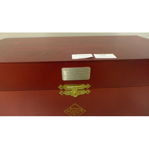 234 - A box of Royal Selangor pewter Four Seasons Collection four-sided vase with wooden stand