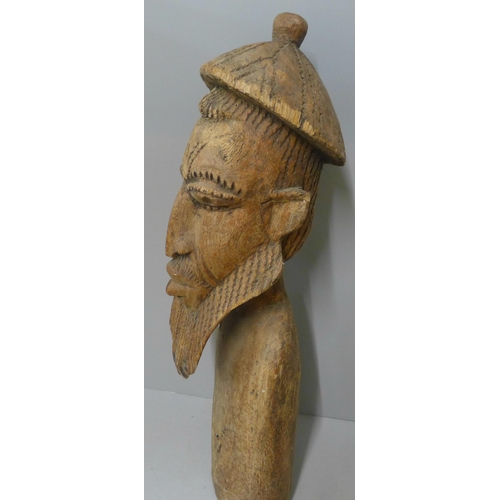 245 - A carved wooden figure, possibly Moorish