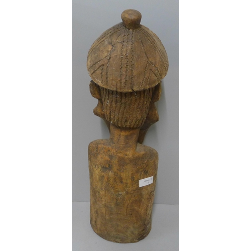 245 - A carved wooden figure, possibly Moorish