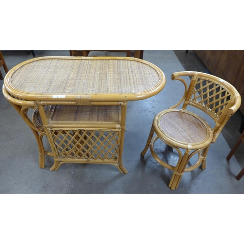 25 - A bamboo and wicker table and two chairs