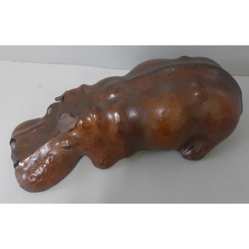 253 - A small brown leather hippopotamus