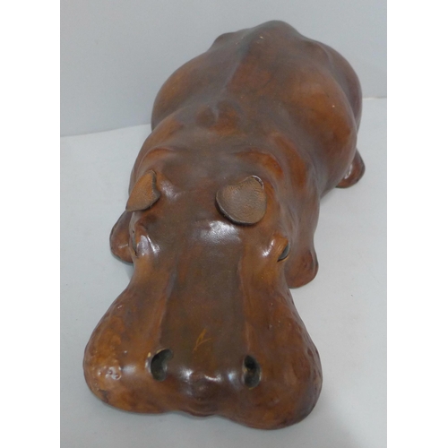 253 - A small brown leather hippopotamus