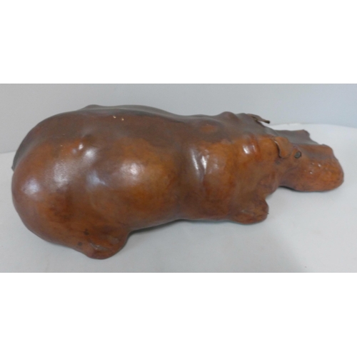 253 - A small brown leather hippopotamus