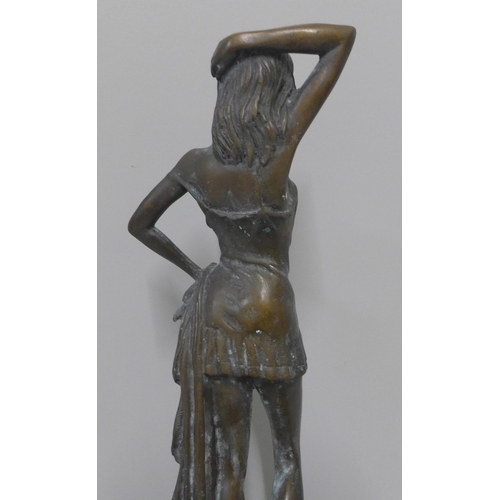 255 - A bronze figure of a lady on, a green marble socle