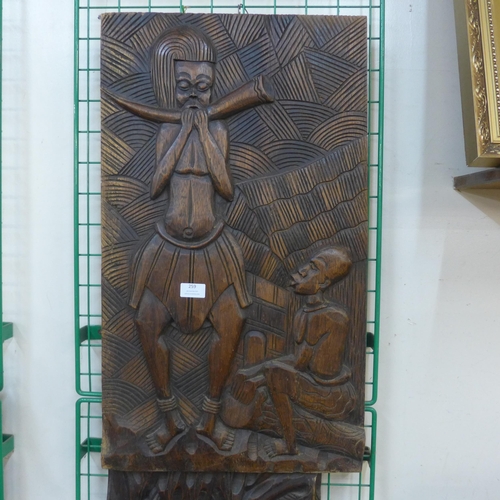 259 - Two African carved wooden plaques