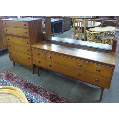 26 - A teak chest of drawers and dressing table