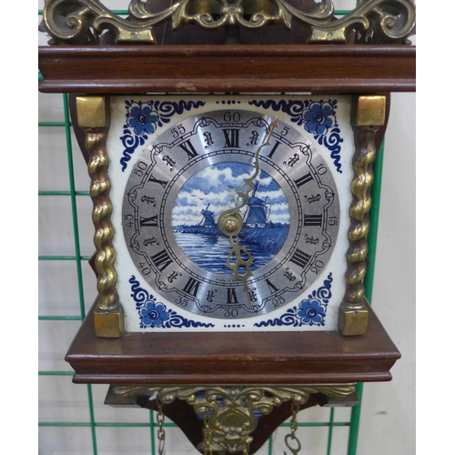 261 - A Dutch mahogany and brass wall clock