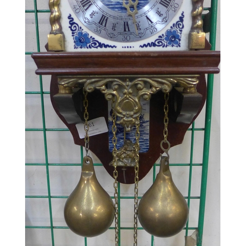 261 - A Dutch mahogany and brass wall clock