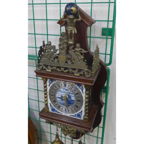 261 - A Dutch mahogany and brass wall clock