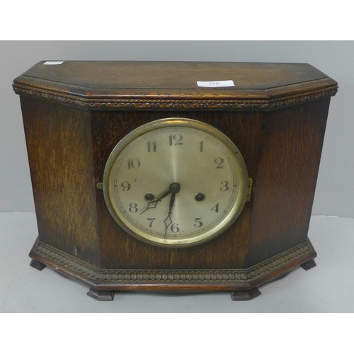 266 - An early 20th Century oak mantel clock