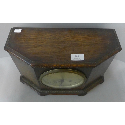 266 - An early 20th Century oak mantel clock