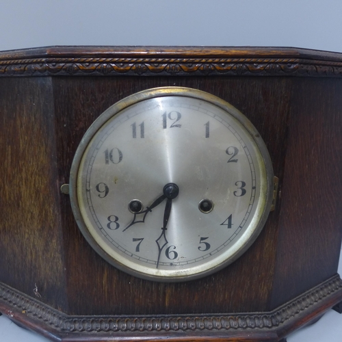 266 - An early 20th Century oak mantel clock