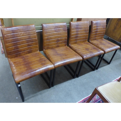 27 - A set of four faux brown leather and black steel chairs