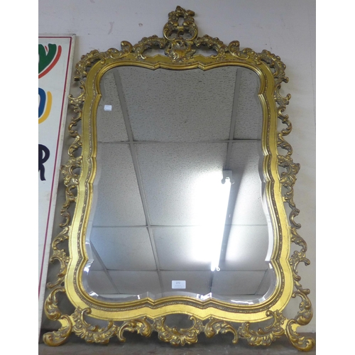 272 - A rococo style gilt framed mirror