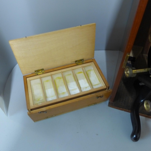 280 - A vintage cased microscope with slides, W. Watson & Sons Ltd., London